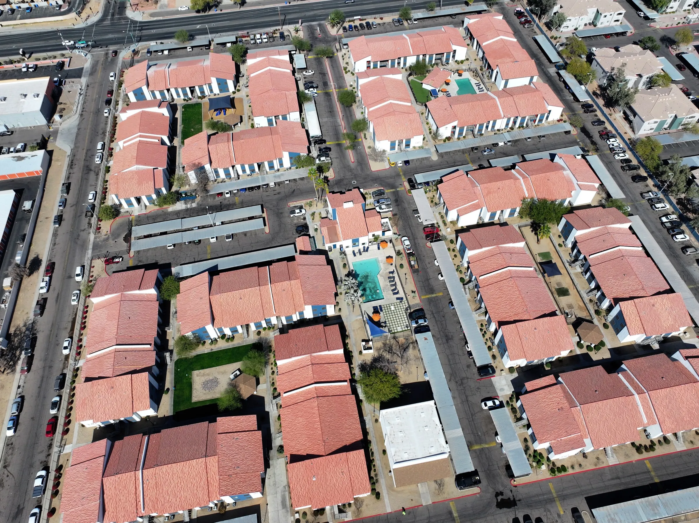 Aerial view of tile roofs across a large multi-building property
